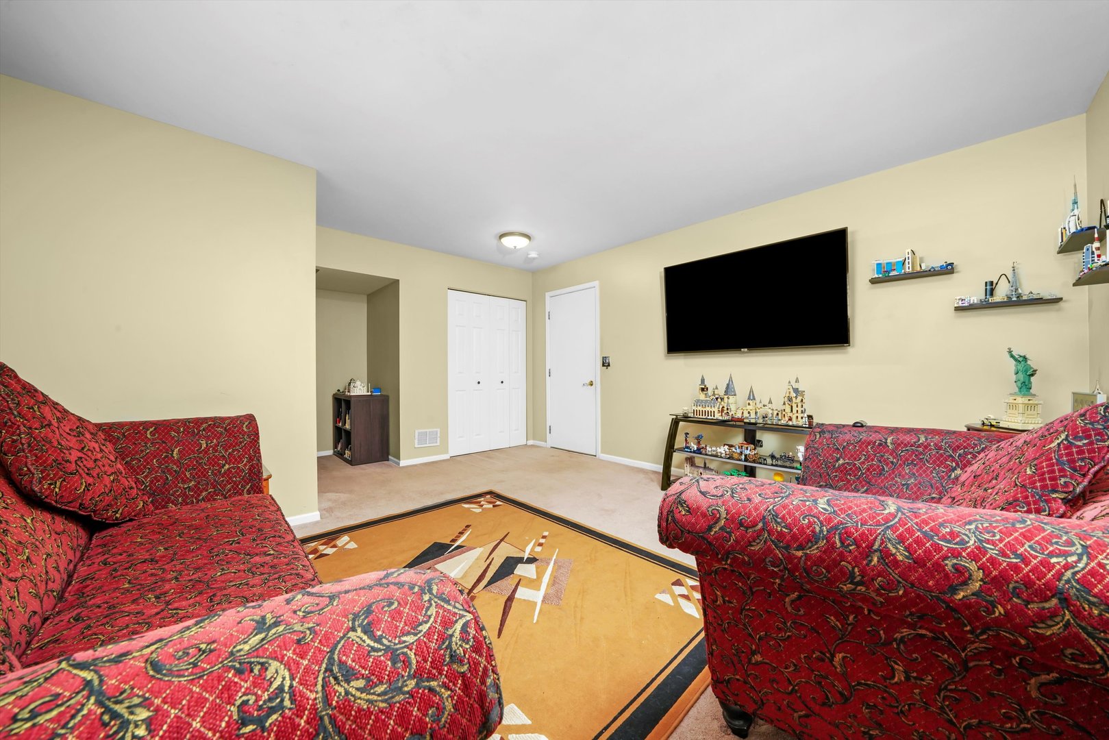 284 Holiday Lane Hainesville, IL 60073 - Photo 15 of 34 a living room with furniture and a flat screen tv