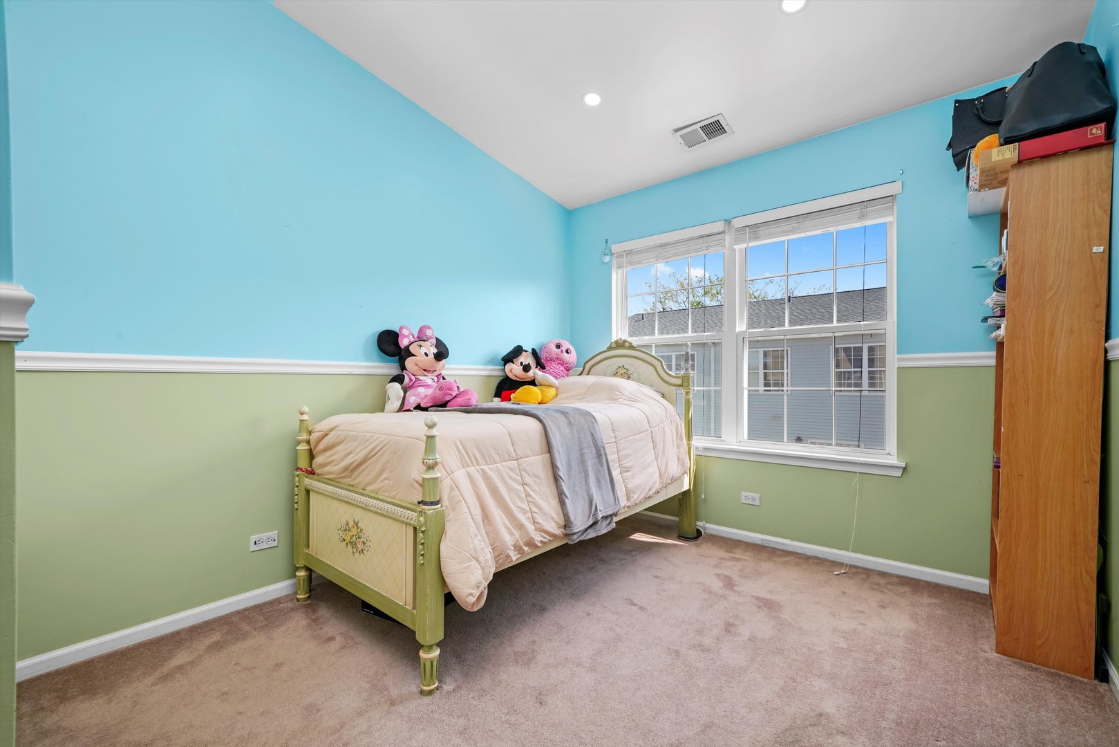 284 Holiday Lane Hainesville, IL 60073 - Photo 22 of 34 a bed sitting in a room next to a window