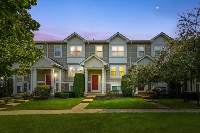 a front view of a house with a yard