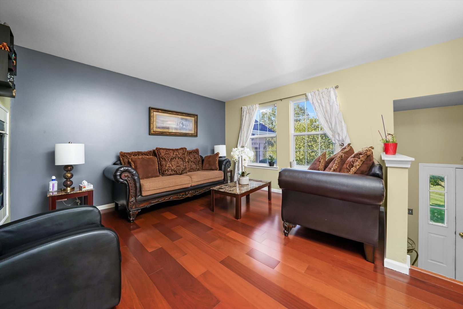 284 Holiday Lane Hainesville, IL 60073 - Photo 8 of 34 a living room with furniture and a large window
