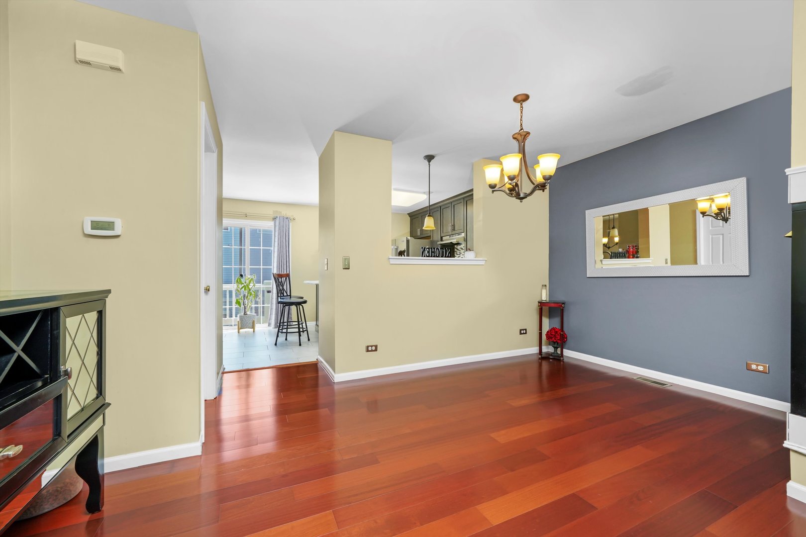 284 Holiday Lane Hainesville, IL 60073 - Photo 10 of 34 wooden floor in an empty room with a window