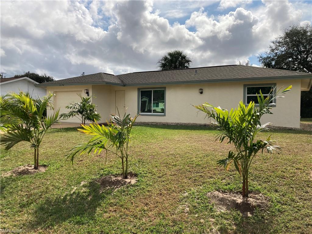 4590 28th Avenue Southwest Naples, FL 34116 - Photo 3 of 37 a view of a house with a yard