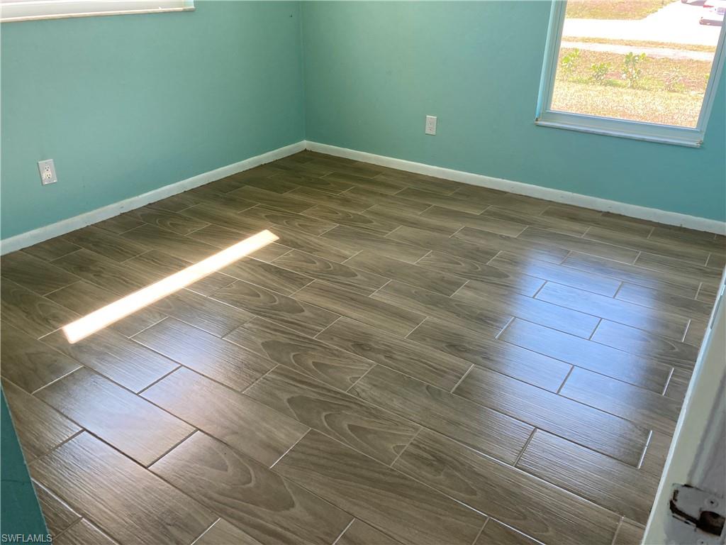 4590 28th Avenue Southwest Naples, FL 34116 - Photo 34 of 37 a view of a room with wooden floor and small space