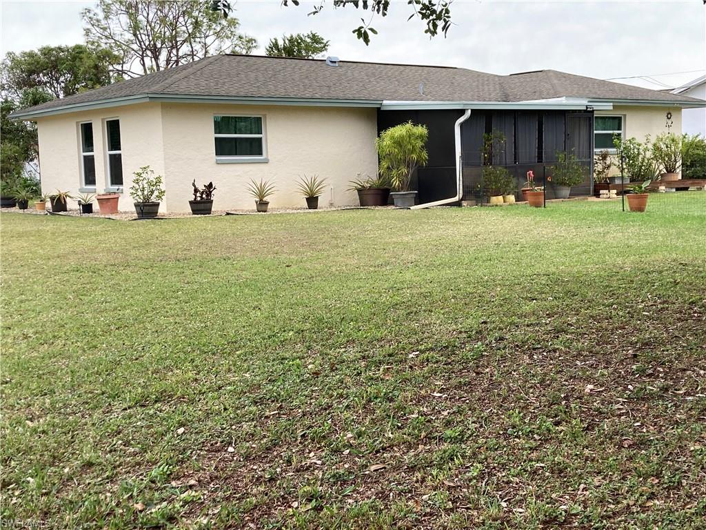 4590 28th Avenue Southwest Naples, FL 34116 - Photo 7 of 37 a view of a house with yard and sitting area
