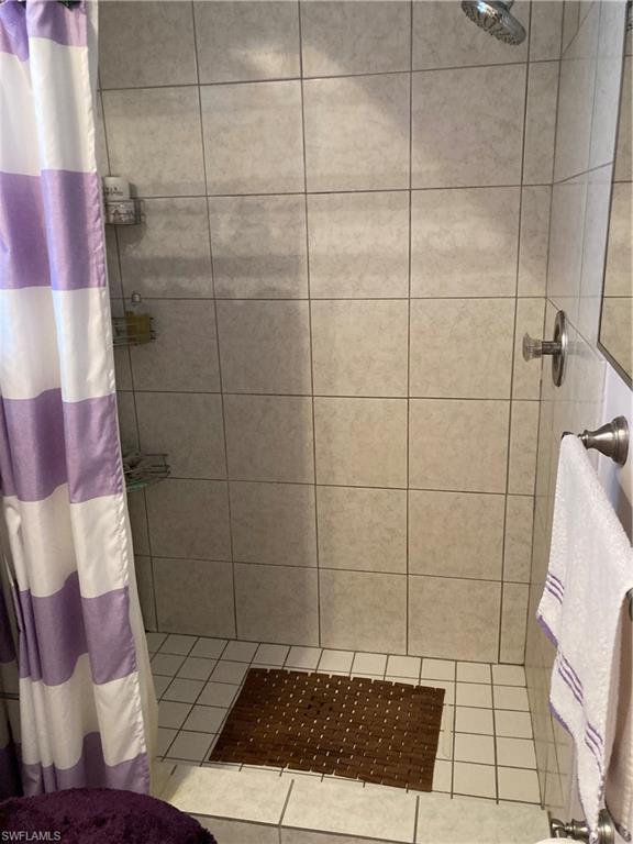 4590 28th Avenue Southwest Naples, FL 34116 - Photo 10 of 37 a bathroom with a shower
