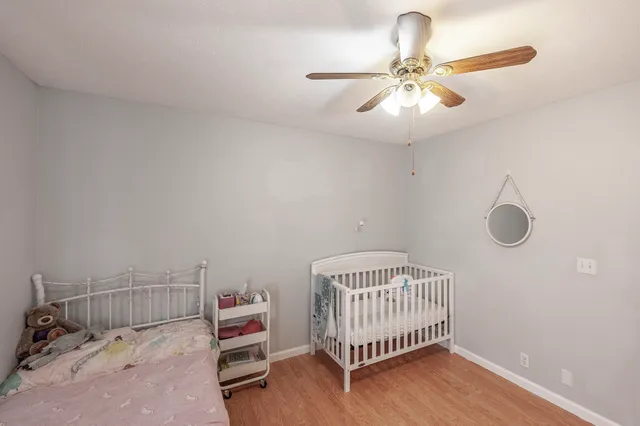 a bathroom with a sink vanity mirror and toilet