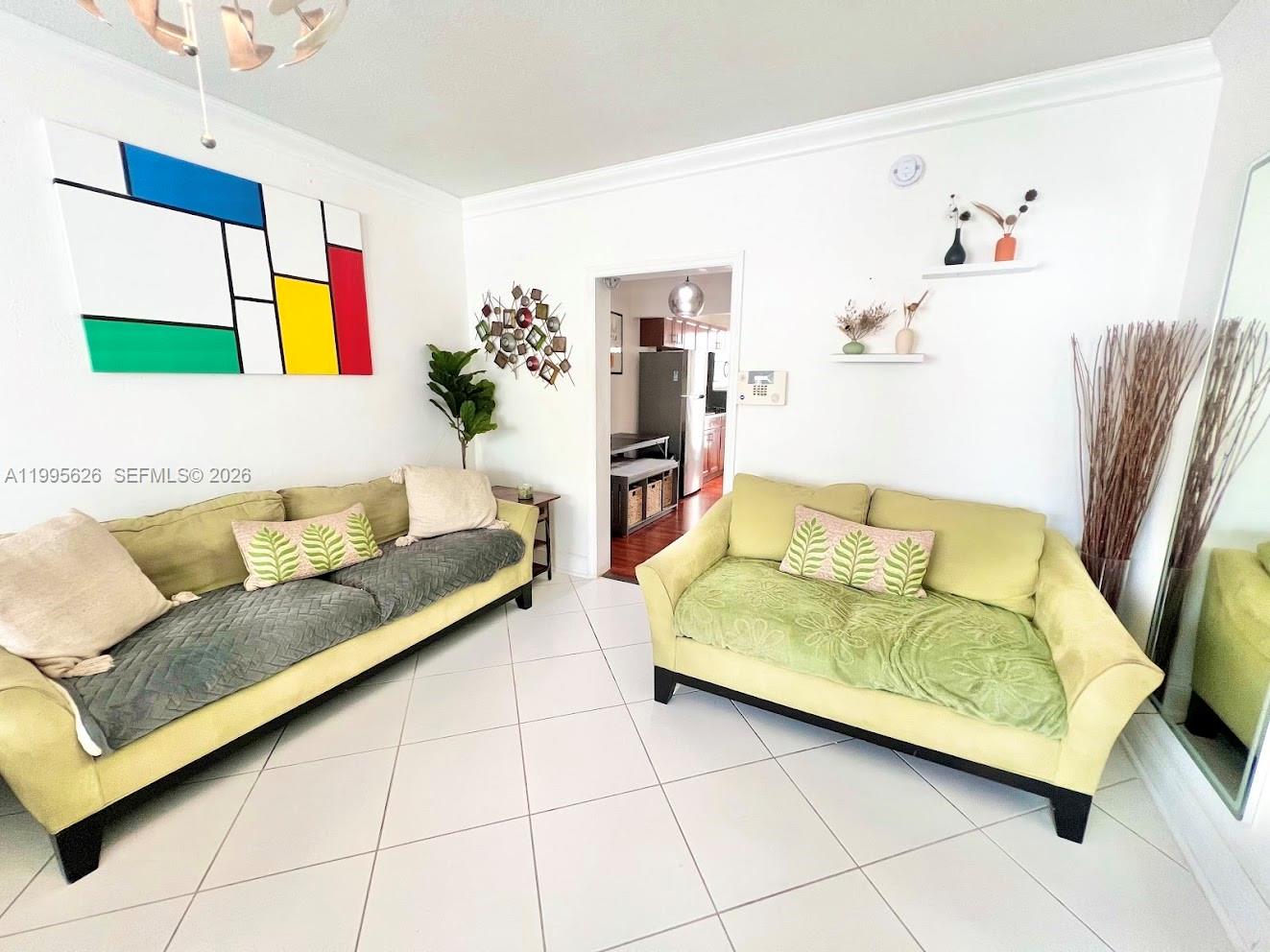 330 74th Street, Unit 5 Miami Beach, FL 33141 - Photo 8 of 19 a living room with furniture and a couch
