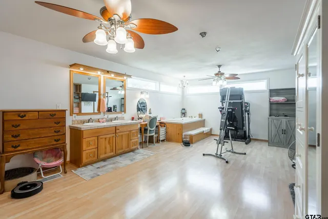 a very nice looking room with a dining table chairs and a large window