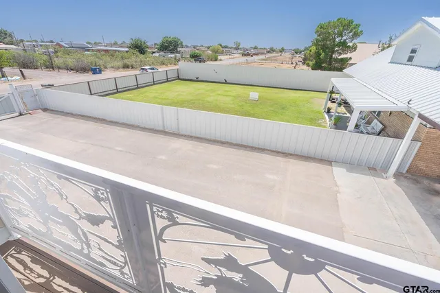 a view of a swimming pool with a lounge chair