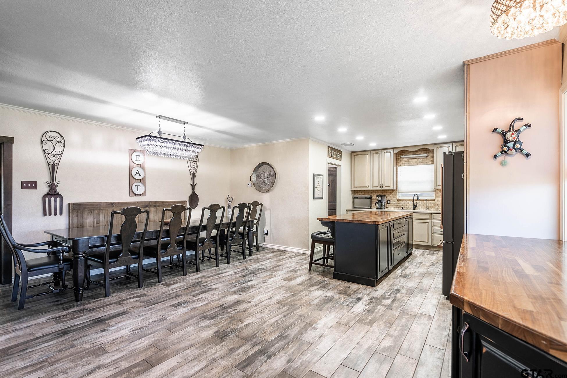 6523 North Sparta Avenue Odessa, TX 79764 - Photo 3 of 38 a living room with lots of furniture and kitchen view