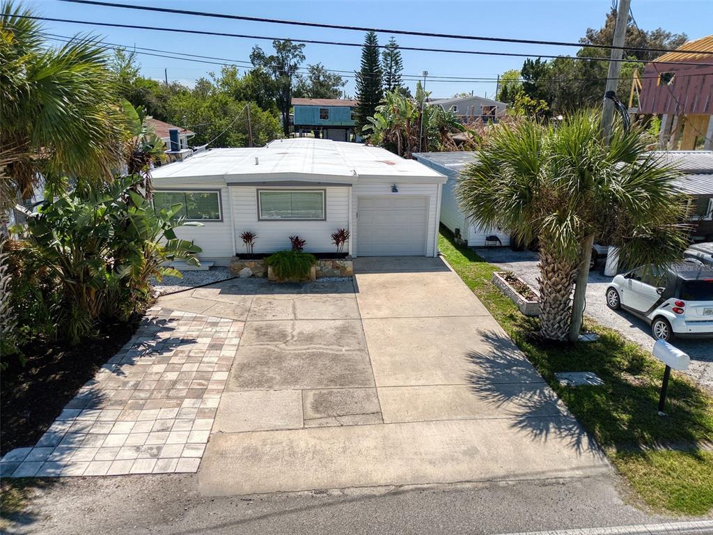 6820 Sea Ranch Drive Hudson, FL 34667 - Photo 3 of 29 a front view of a house with garden