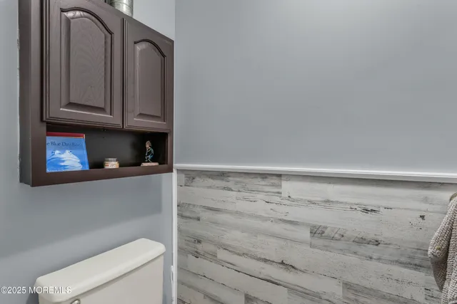 a bathroom with a toilet and a sink