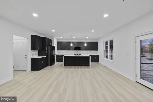 a view of empty room with windows