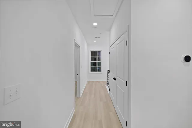 a view of a closet with racks on the wall