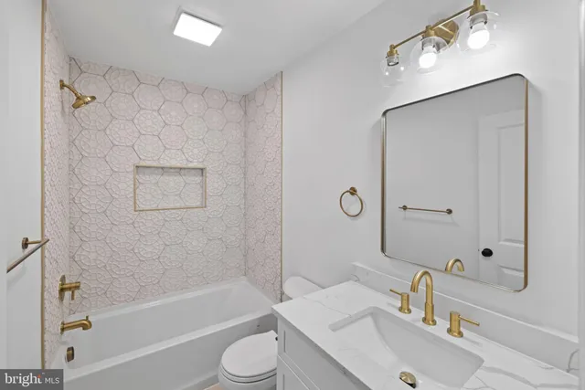 a view of an empty room with a fireplace