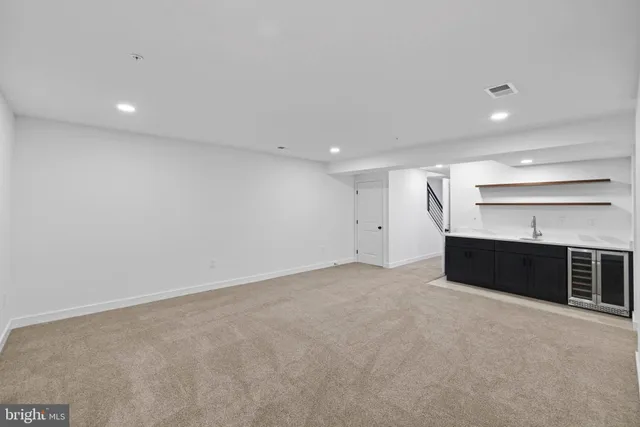 an aerial view of residential houses with outdoor space and street view