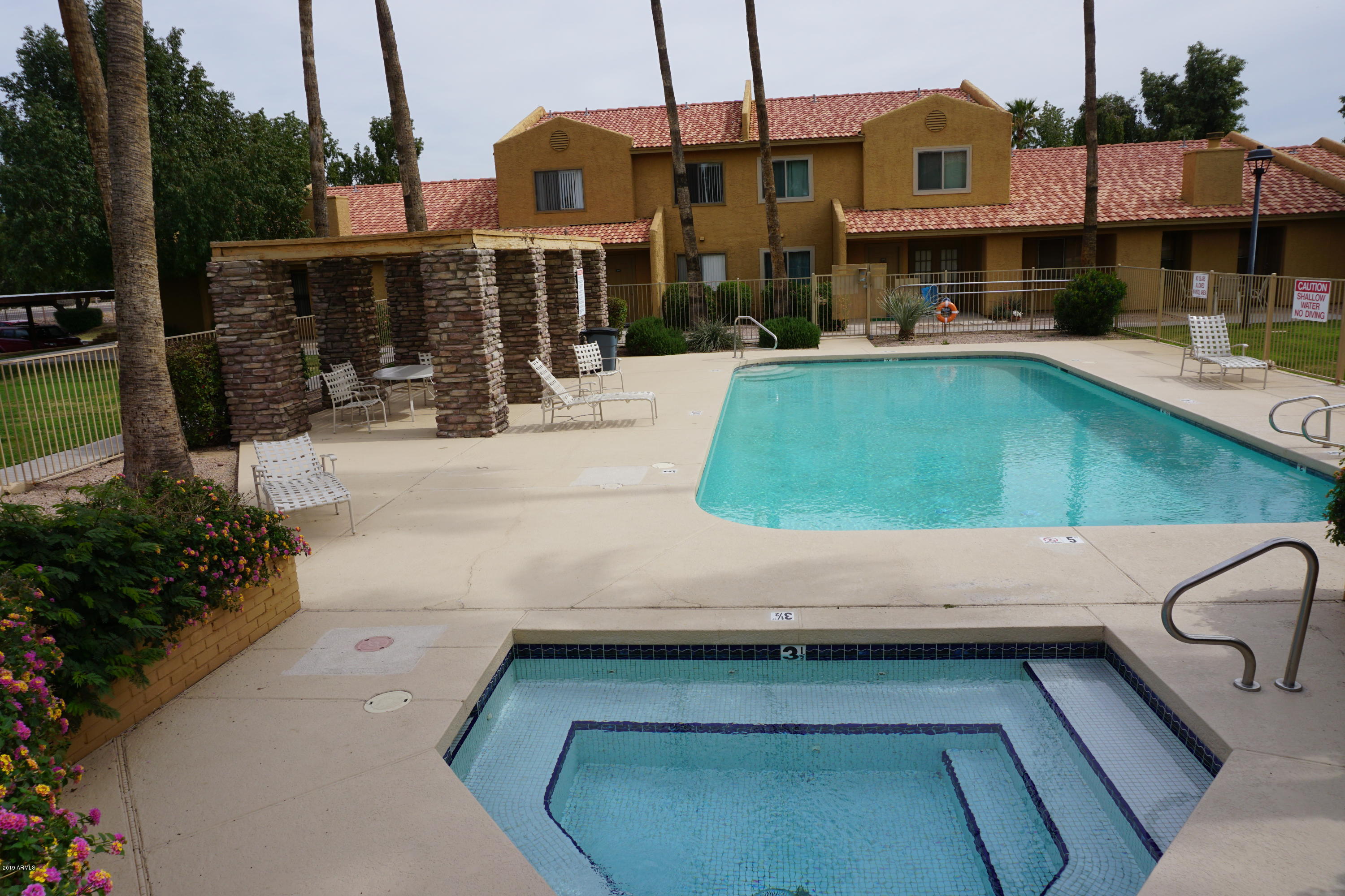 3511 East Baseline Road, Unit 1194 Phoenix, AZ 85042 - Photo 4 of 12 a view of a patio with chairs and tables
