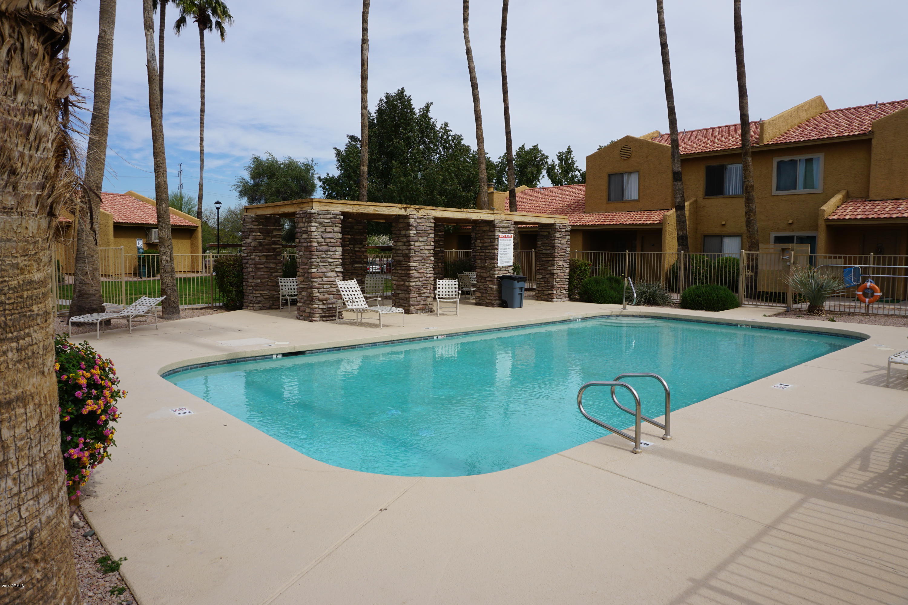 3511 East Baseline Road, Unit 1194 Phoenix, AZ 85042 - Photo 5 of 12 a view of a house with a swimming pool