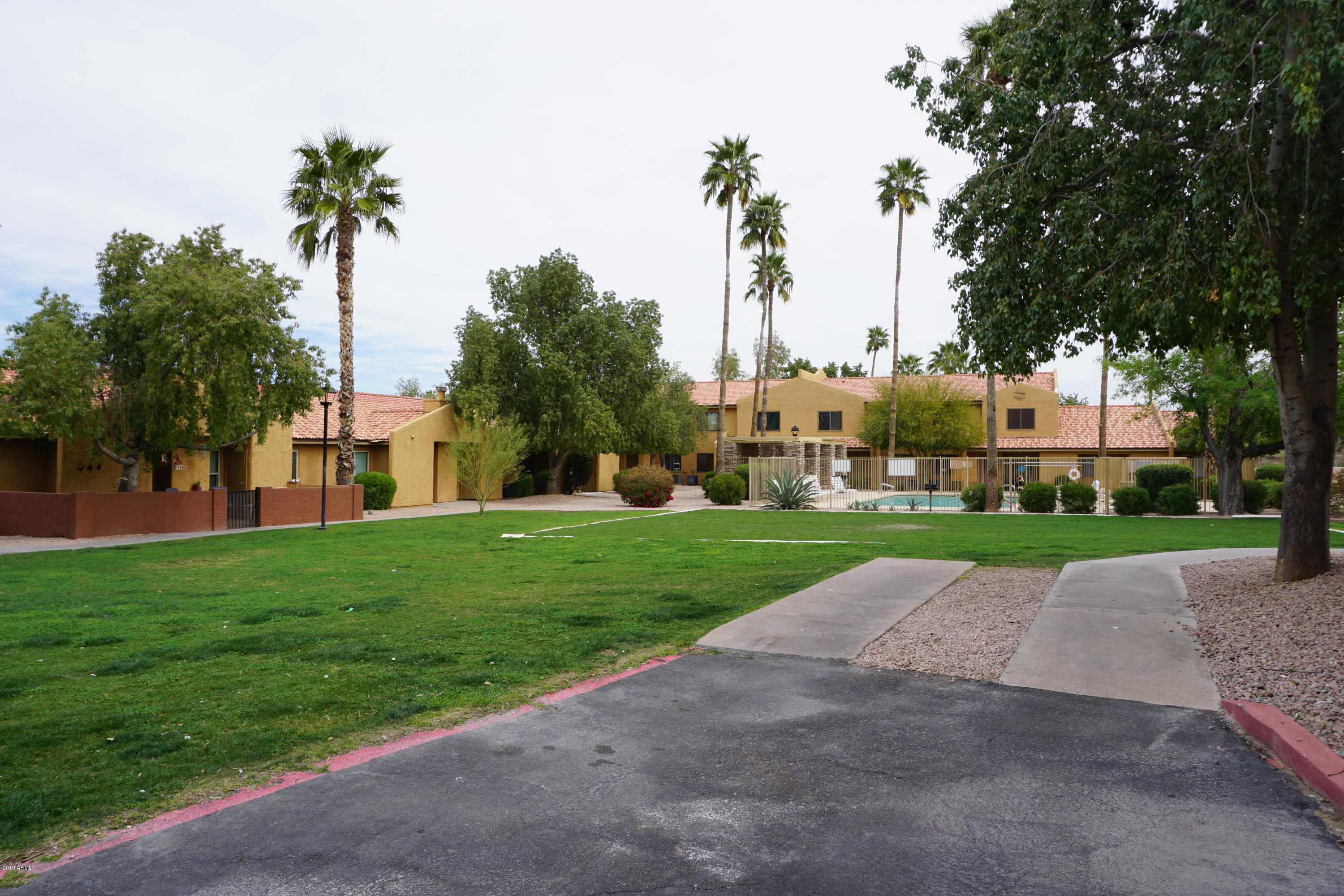 3511 East Baseline Road, Unit 1194 Phoenix, AZ 85042 - Photo 8 of 12 a view of a park with palm trees