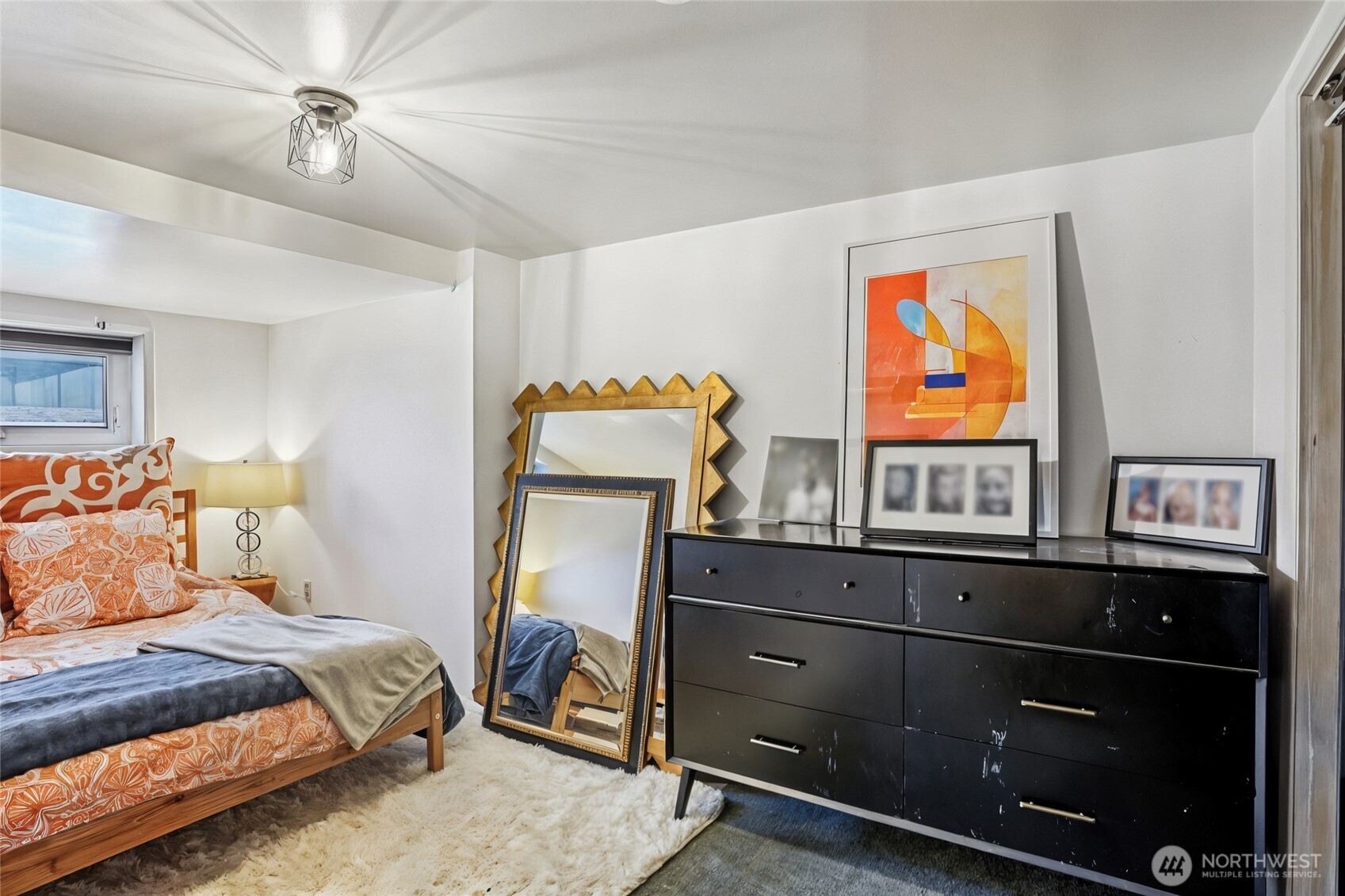 1113 33rd Avenue South Seattle, WA 98144 - Photo 20 of 28 a bedroom with furniture and a flat screen tv