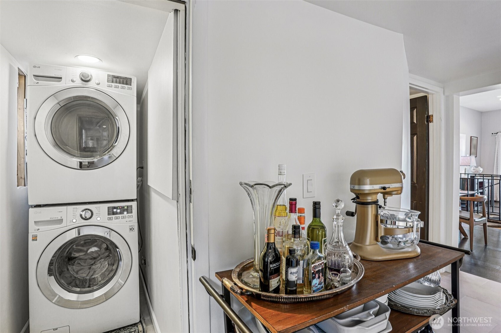 1113 33rd Avenue South Seattle, WA 98144 - Photo 22 of 28 a view of a dining room with furniture a rug and a mirror