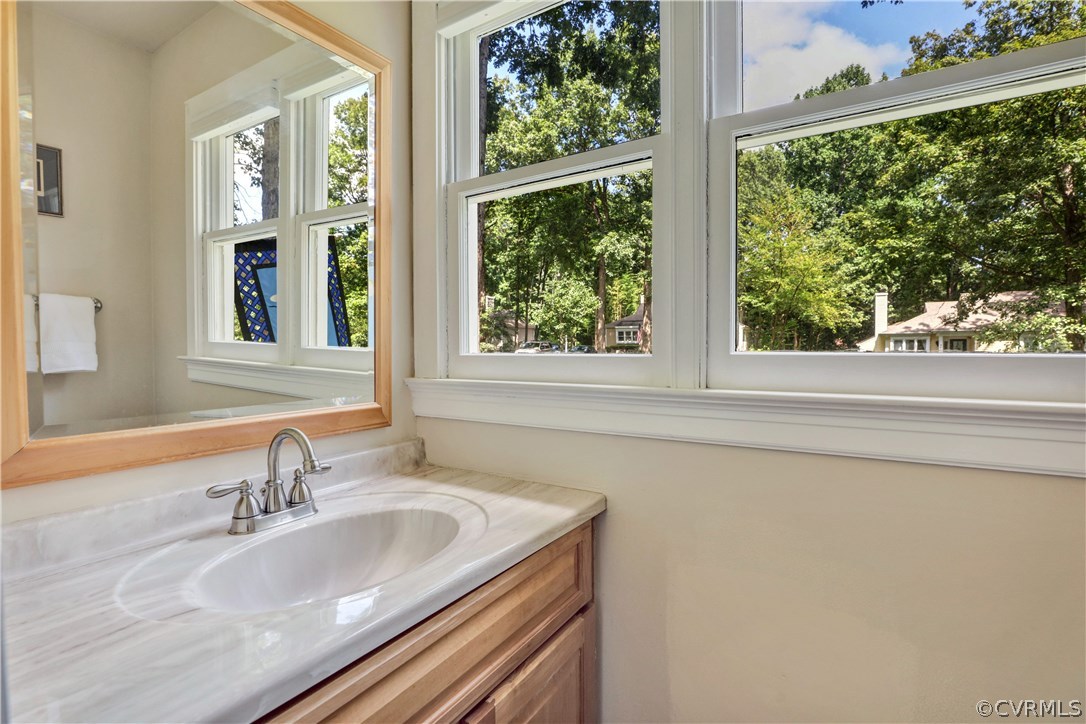 5612 Woods Walk Road Midlothian, VA 23112 - Photo 12 of 26 a bathroom with a sink and a large window