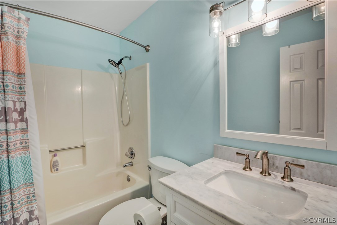 5612 Woods Walk Road Midlothian, VA 23112 - Photo 20 of 26 a bathroom with a granite countertop sink toilet and shower