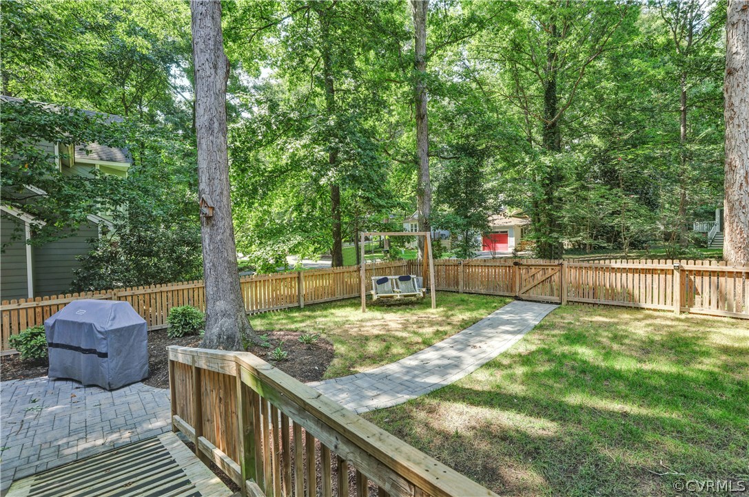 5612 Woods Walk Road Midlothian, VA 23112 - Photo 23 of 26 a view of backyard with green space and trampoline