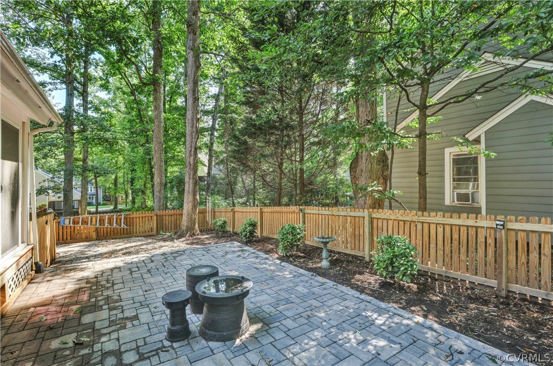 5612 Woods Walk Road Midlothian, VA 23112 - Photo 24 of 26 a view of a back yard from a patio