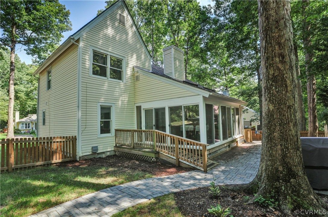 5612 Woods Walk Road Midlothian, VA 23112 - Photo 26 of 26 a view of a house with a yard and a wooden fence