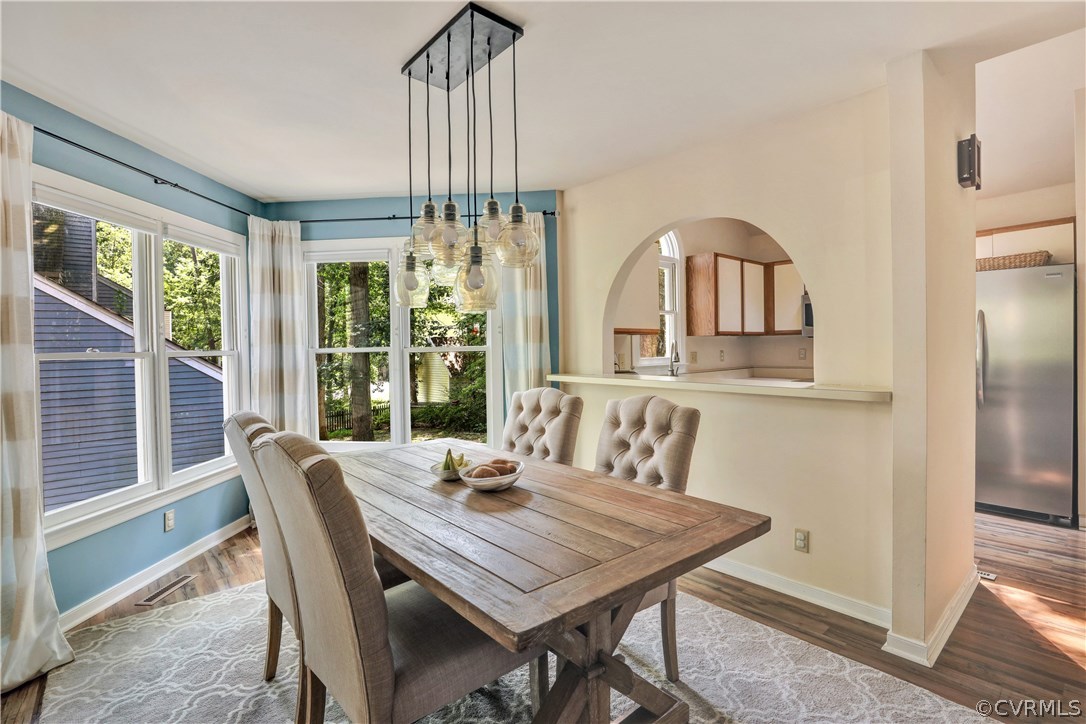 5612 Woods Walk Road Midlothian, VA 23112 - Photo 6 of 26 a view of a dining room with furniture window and outside view