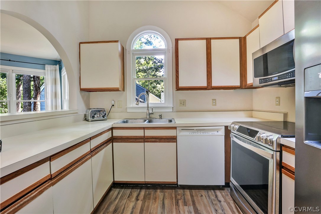 5612 Woods Walk Road Midlothian, VA 23112 - Photo 7 of 26 a kitchen with a sink stove and microwave