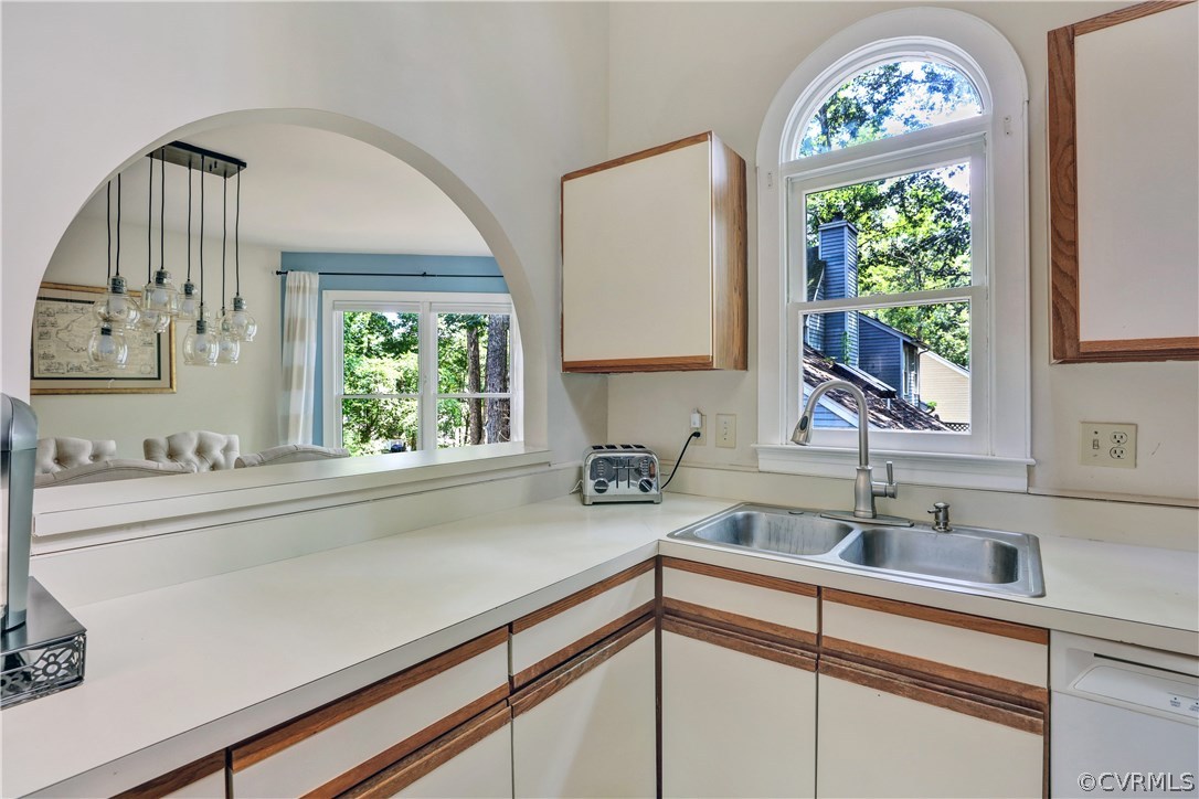 5612 Woods Walk Road Midlothian, VA 23112 - Photo 9 of 26 a sink with a large mirror and a window