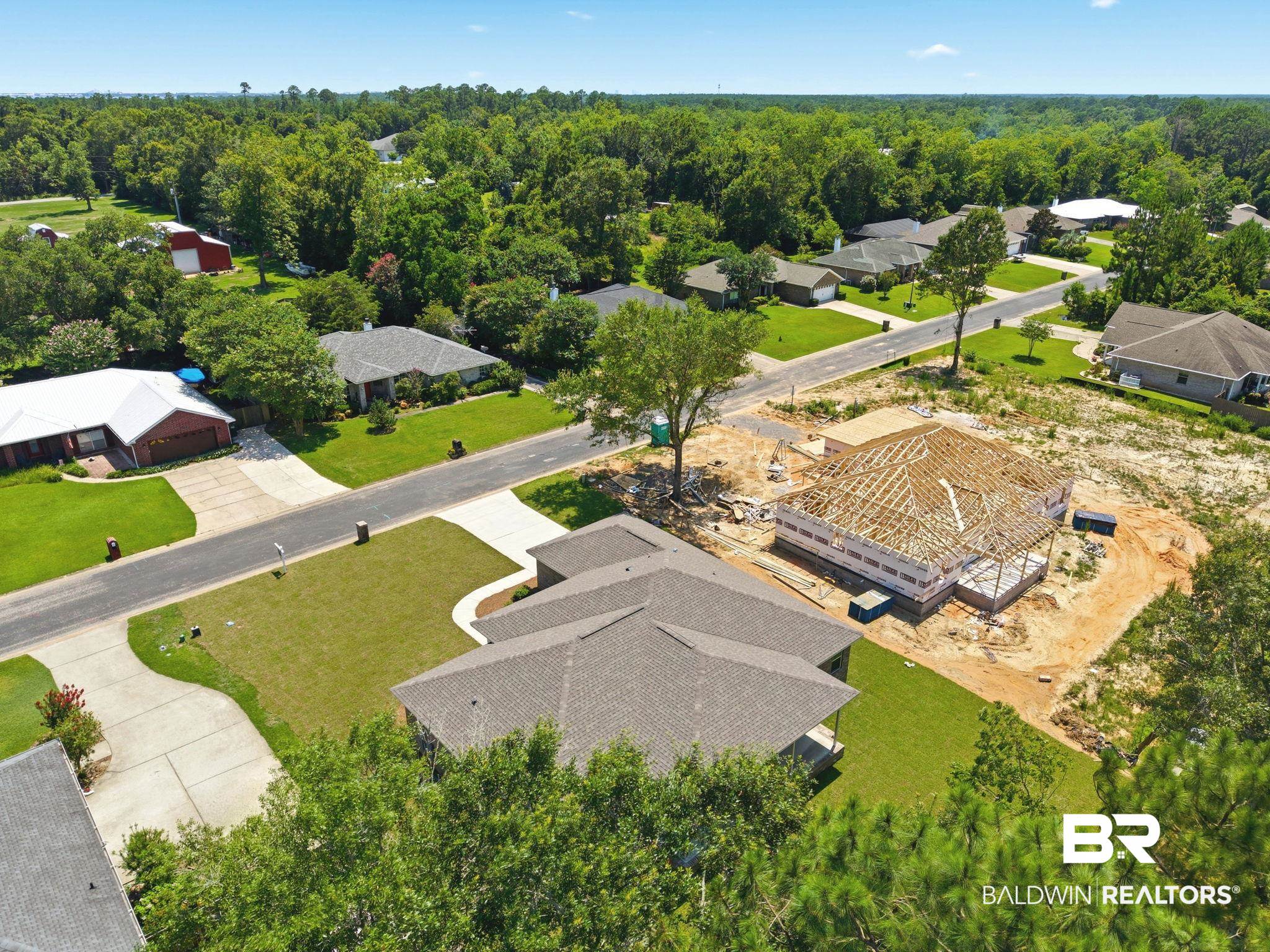 32656 Arbor Ridge Circle Lillian, AL 36549 - Photo 43 of 56 New construction opportunity featuring a framed structure, an installed roof, and a clear building site