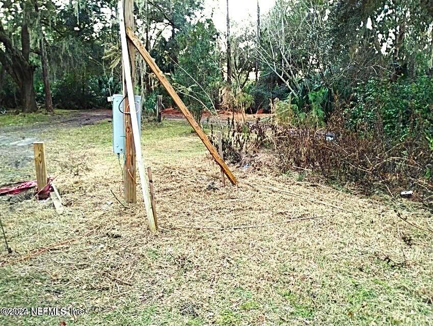 104 Riverside Lane Palatka, FL 32177 - Photo 1 of 22 a view of a yard with a tree