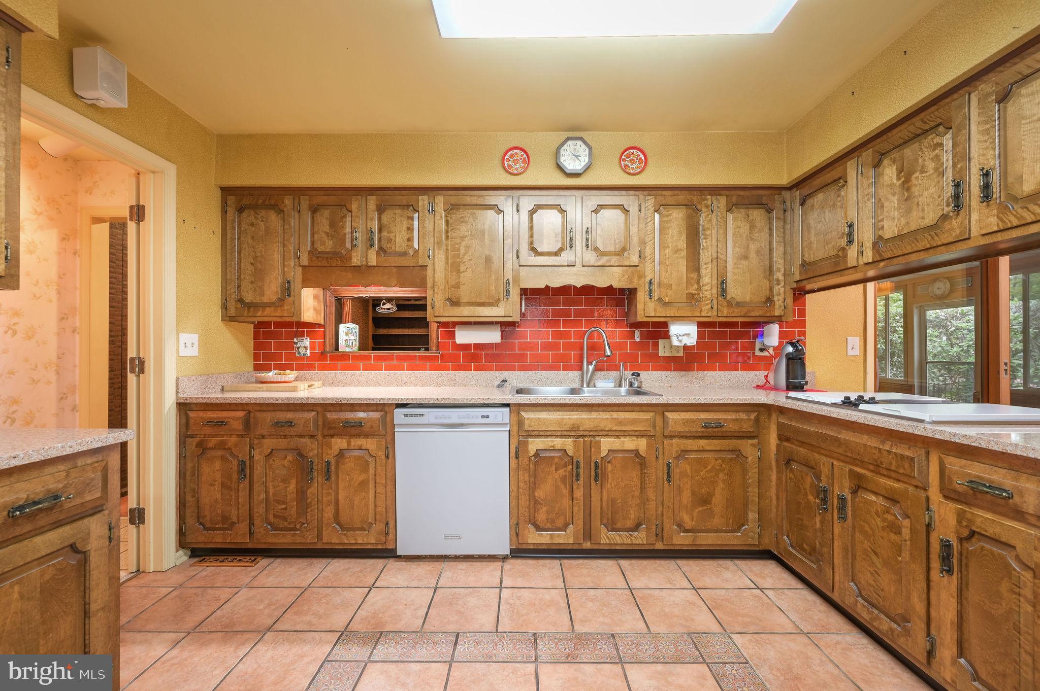 235 Carnoustie Road Dover, DE 19904 - Photo 12 of 30 a kitchen with stainless steel appliances granite countertop a stove a sink and a cabinets