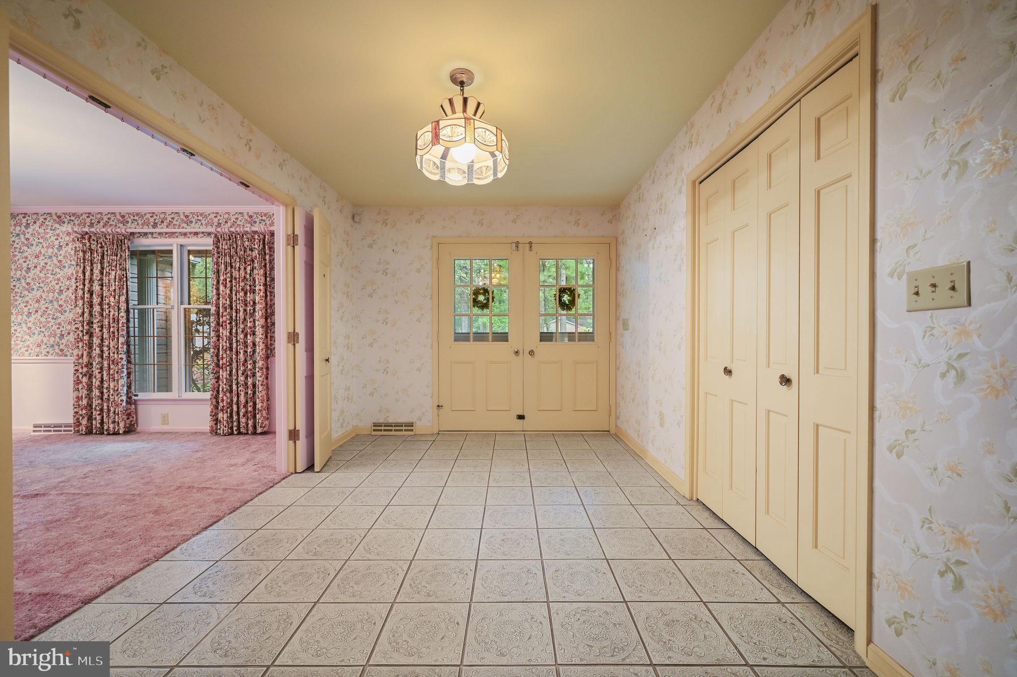 235 Carnoustie Road Dover, DE 19904 - Photo 14 of 30 a view of an empty room with window and chandelier fan