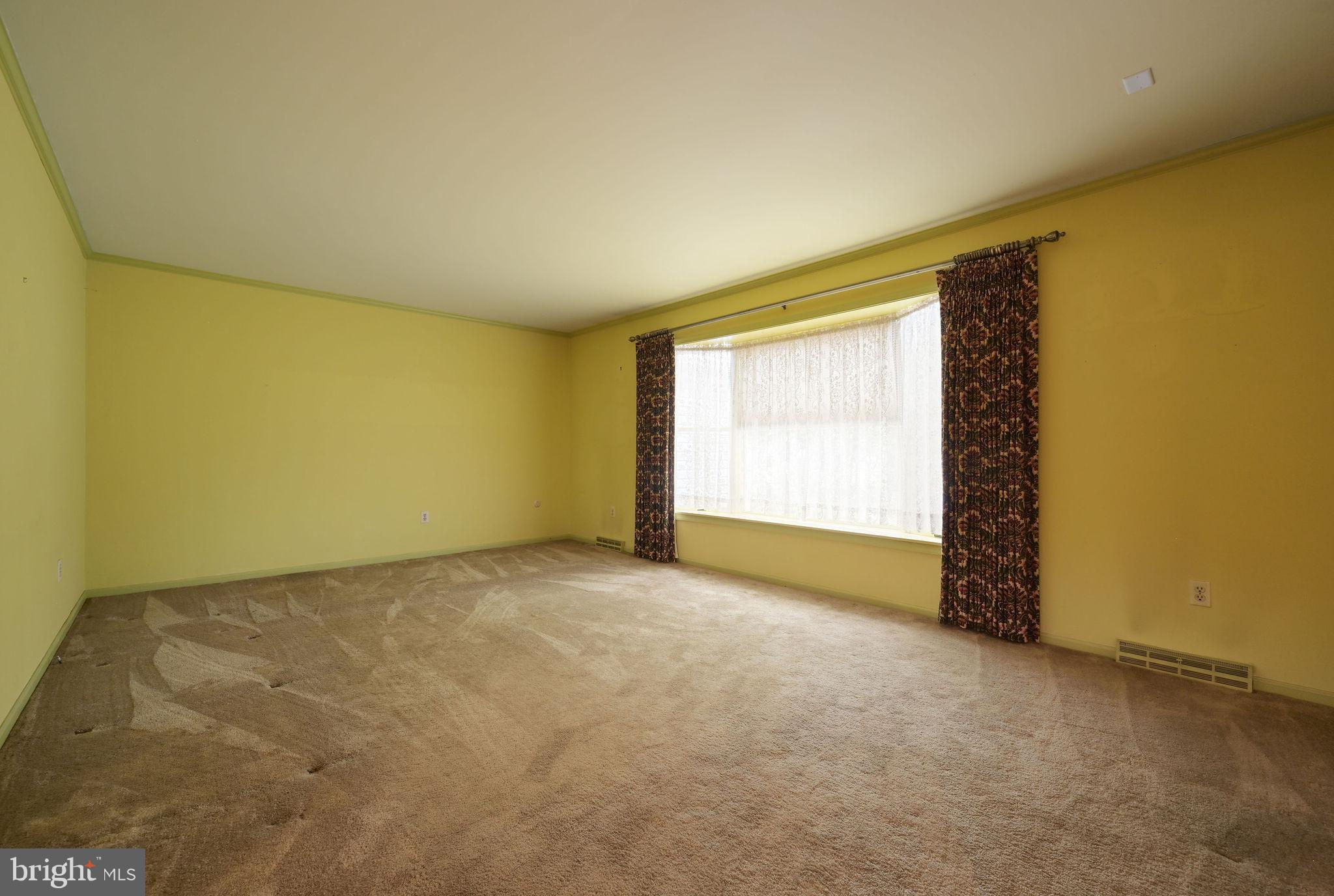 235 Carnoustie Road Dover, DE 19904 - Photo 16 of 30 a view of an empty room with a window