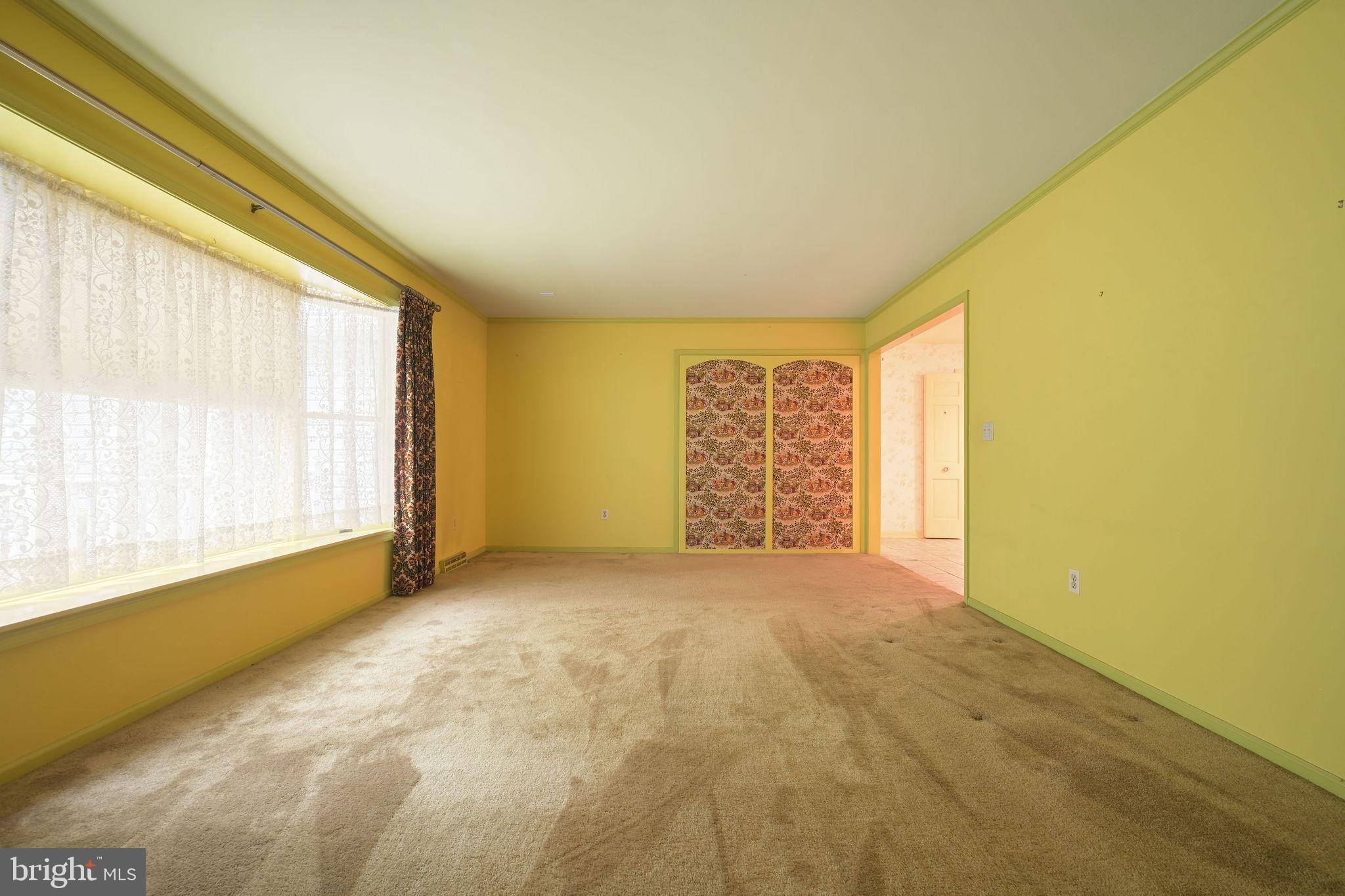 235 Carnoustie Road Dover, DE 19904 - Photo 17 of 30 a view of an empty room with a window