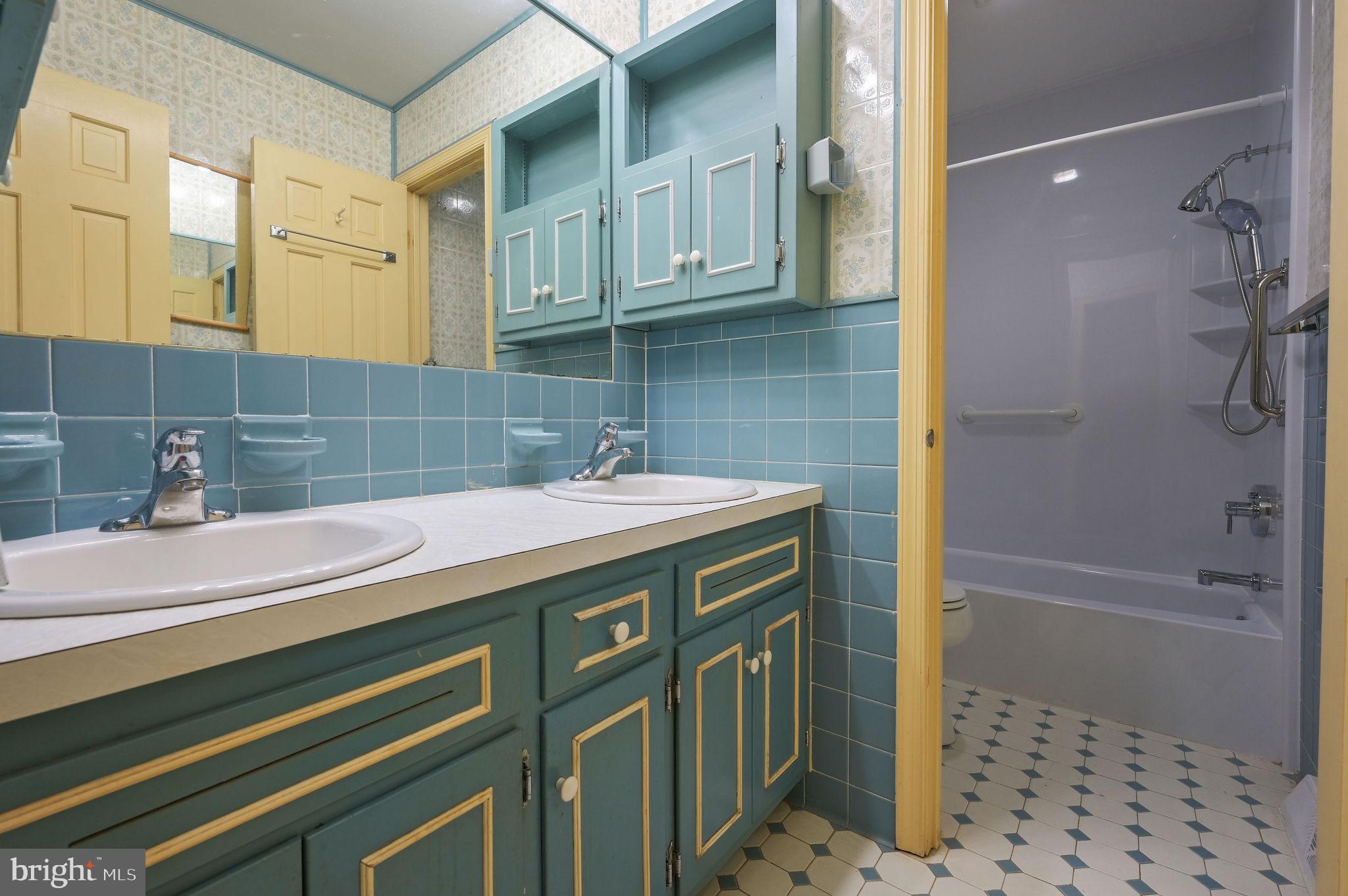 235 Carnoustie Road Dover, DE 19904 - Photo 18 of 30 a bathroom with a sink a toilet and shower