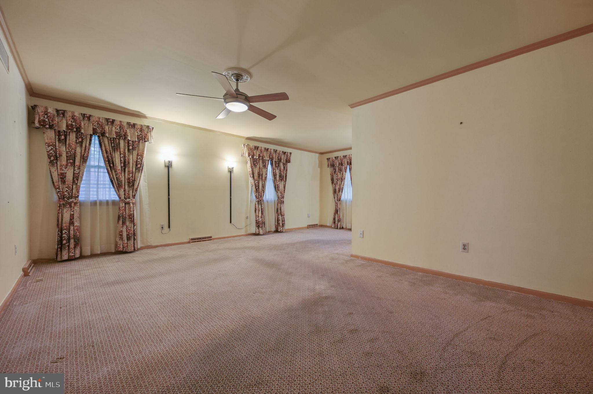 235 Carnoustie Road Dover, DE 19904 - Photo 19 of 30 a view of a hallway with a ceiling fan