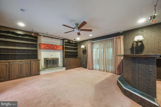 a view of a livingroom with a projector and furniture