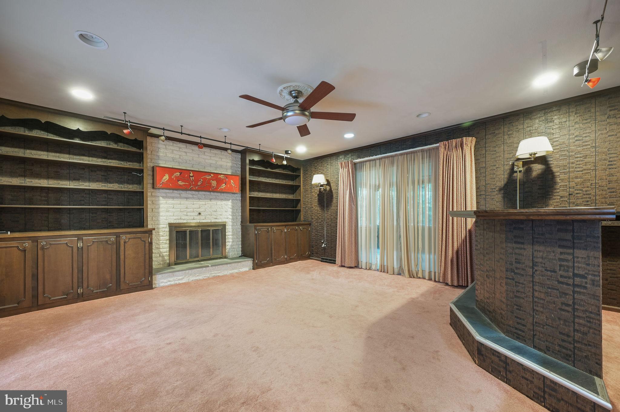 235 Carnoustie Road Dover, DE 19904 - Photo 22 of 30 a view of an empty room with a fireplace