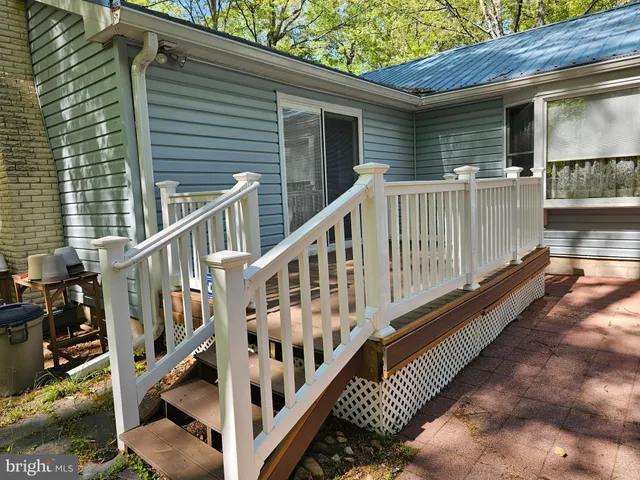 a view of deck with wooden floor and fence
