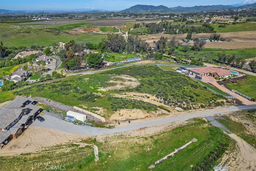 0 Summit Circle Temecula, CA 92592 - Photo 3 of 13 an aerial view of a golf course with a lake view