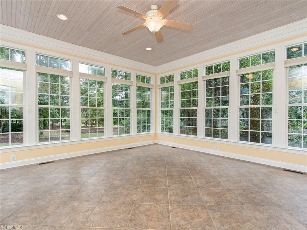 6001 Dunvagen Court Oak Ridge, NC 27310 - Photo 15 of 30 Four Seasons Sunroom with walls of windows...