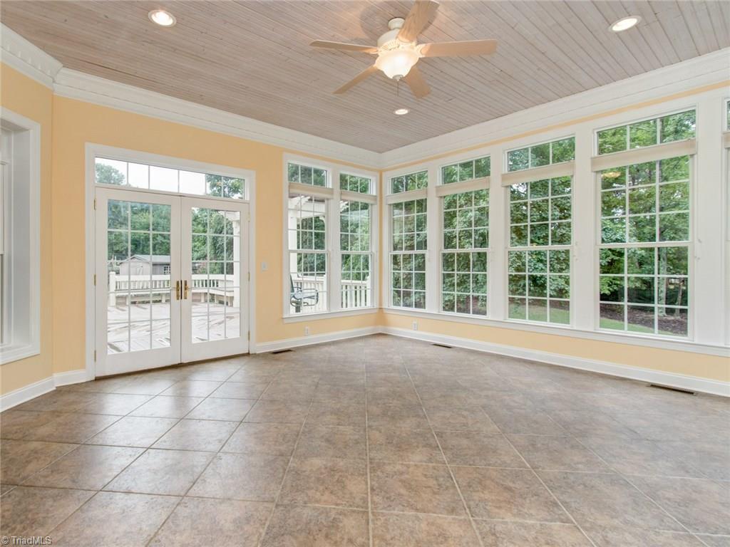 6001 Dunvagen Court Oak Ridge, NC 27310 - Photo 16 of 30 Well appointed Sunroom with tile flooring, recessed lighting and private views of professionally landscaped yard....