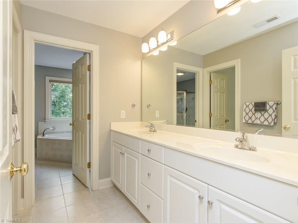 6001 Dunvagen Court Oak Ridge, NC 27310 - Photo 19 of 30 Sparking Master bath with double vanity.