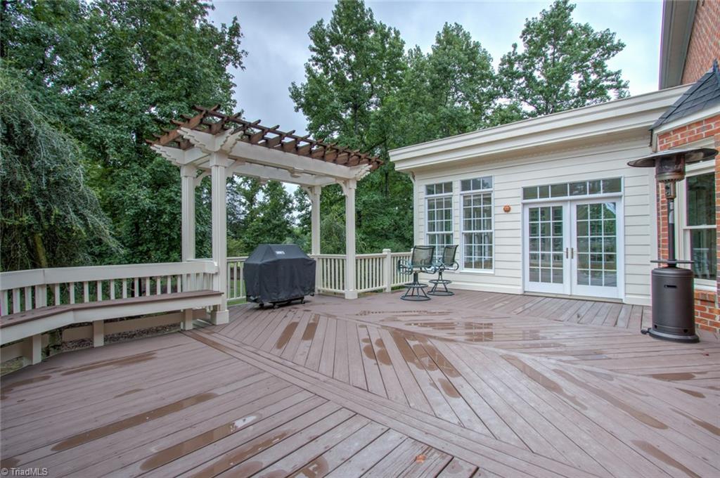 6001 Dunvagen Court Oak Ridge, NC 27310 - Photo 26 of 30 Expansive Deck with Pergola and built in seating. Great for outdoor living and entertaining!