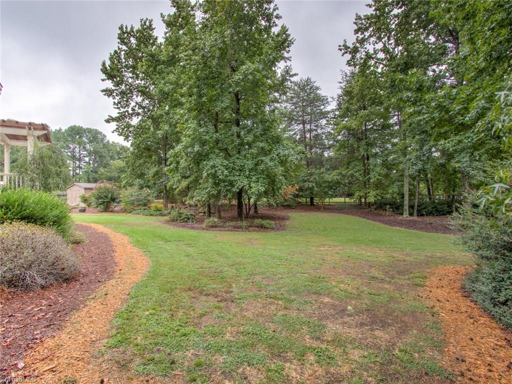 6001 Dunvagen Court Oak Ridge, NC 27310 - Photo 27 of 30 View of back yard is a "park like" setting...